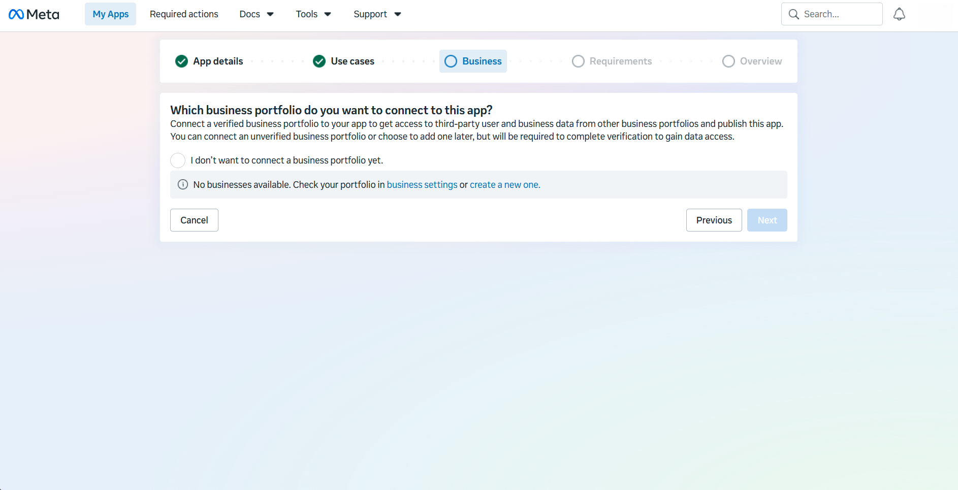 Meta app creation wizard Business step asking which business portfolio to connect, with the option to skip selected